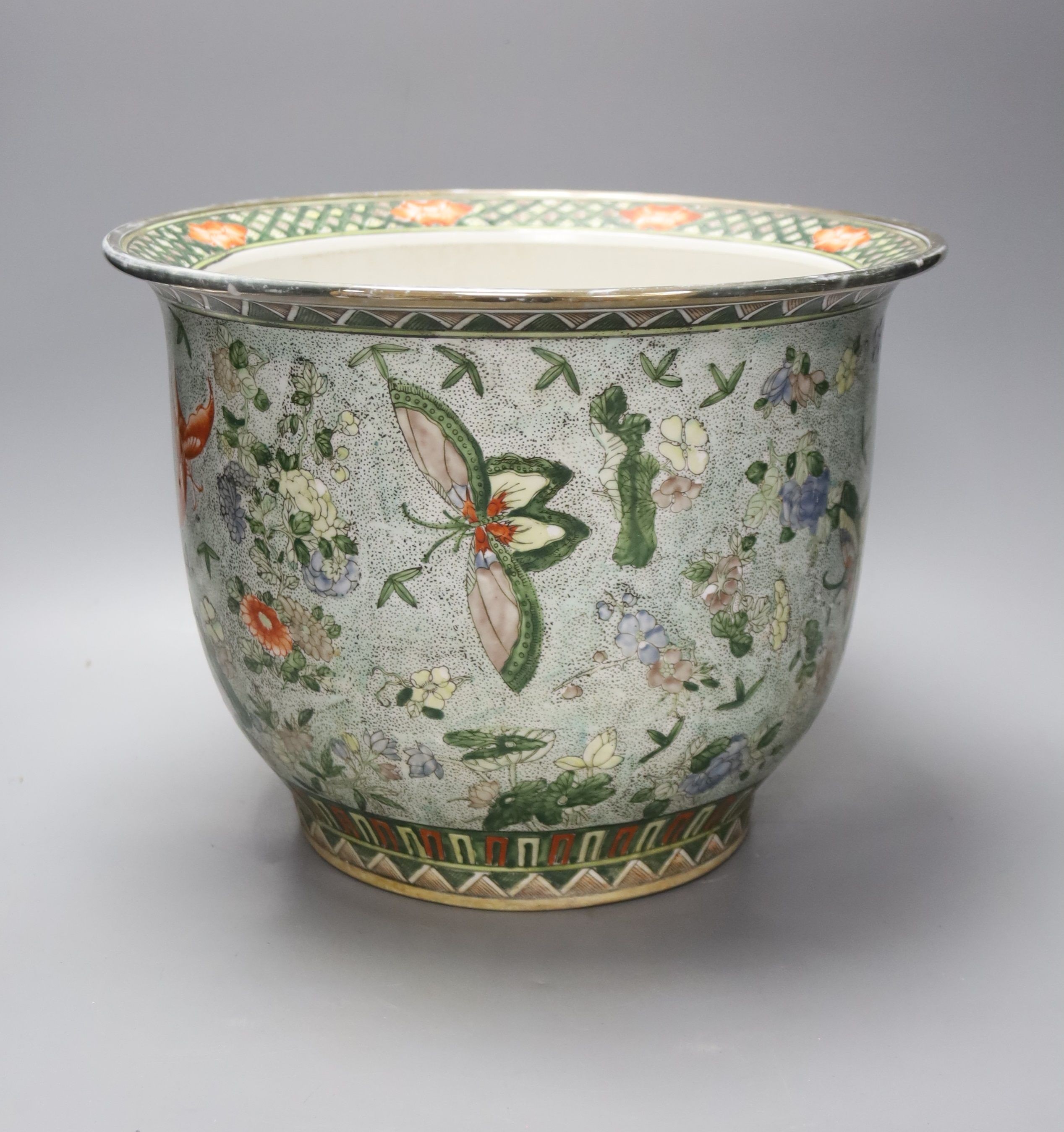 A 20th century Chinese pale blue ground jardiniere, painted with flowers and insects, height 24cm